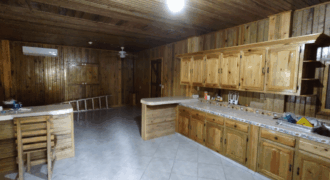Terreno de venta en Omoa Cortes con naciente de agua y cabañas