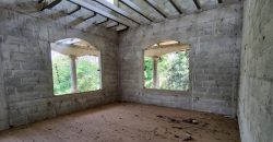 Terreno de venta en Omoa Cortes con naciente de agua y cabañas