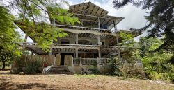 Terreno de venta en Omoa Cortes con naciente de agua y cabañas