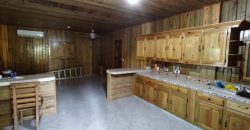 Terreno de venta en Omoa Cortes con naciente de agua y cabañas