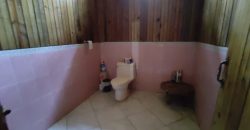 Terreno de venta en Omoa Cortes con naciente de agua y cabañas