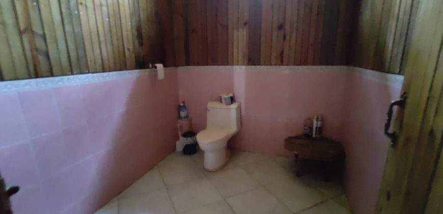 Terreno de venta en Omoa Cortes con naciente de agua y cabañas